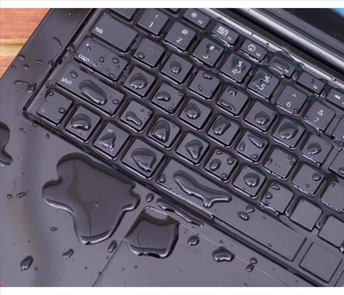 Water spilled in the keyboard of a computer.